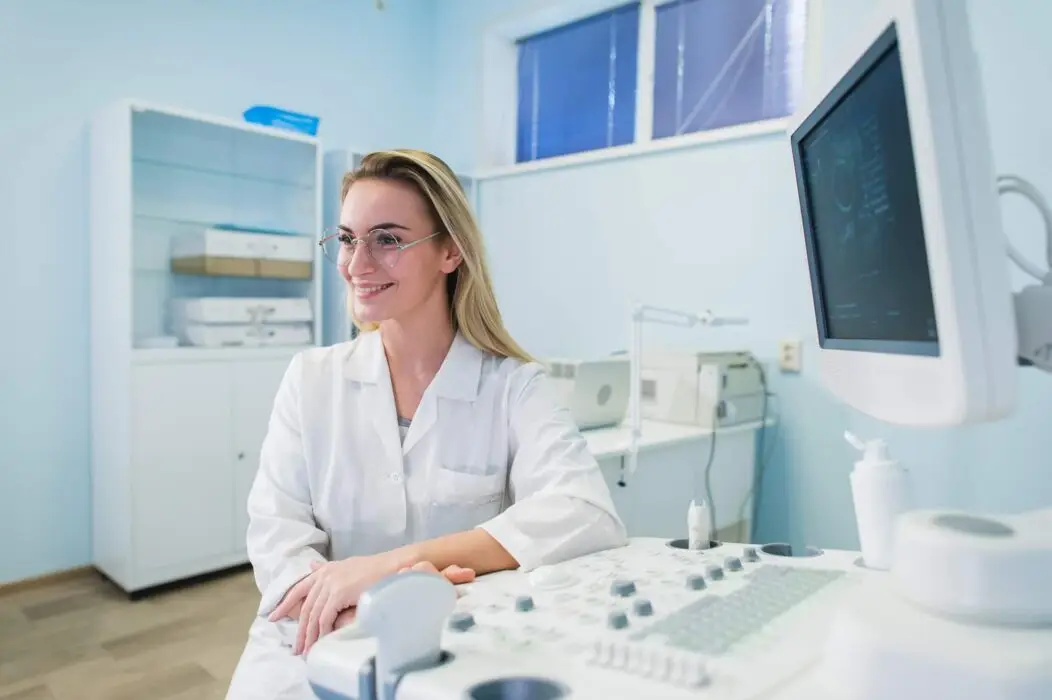 portrait of young female dentist in office
