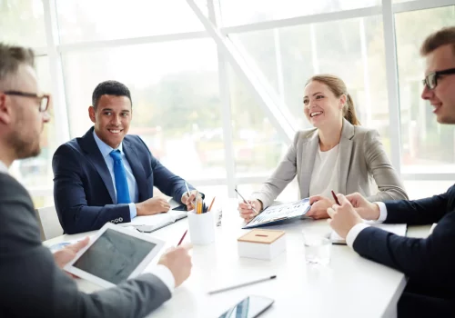 Conversation of successful young co-workers