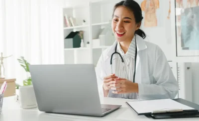 Optimized-young-lady-doctor-using-computer-laptop-talk-video-2021-08-31-20-07-31-utc