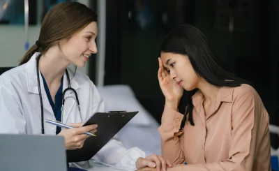 friendly-female-doctor-hands-holding-patient-hand