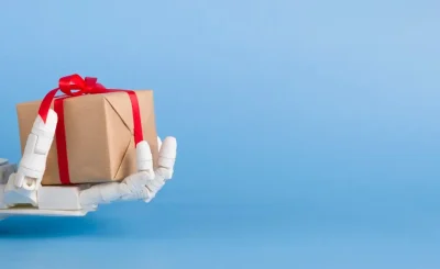 Gift box in automated robot hand, blue background